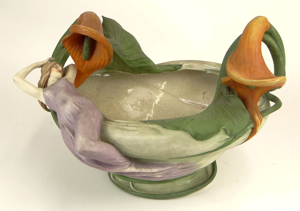 Large Art Nouveau Amphora Pottery Centerpiece with: Large Art Nouveau Amphora Pottery Centerpiece with Figural Reclining Lady and Calla Lily Decoration. Signed. Small Damage to a Calla Lily Stem Otherwise Good Condition. Measures 11 Inches Tall and 16