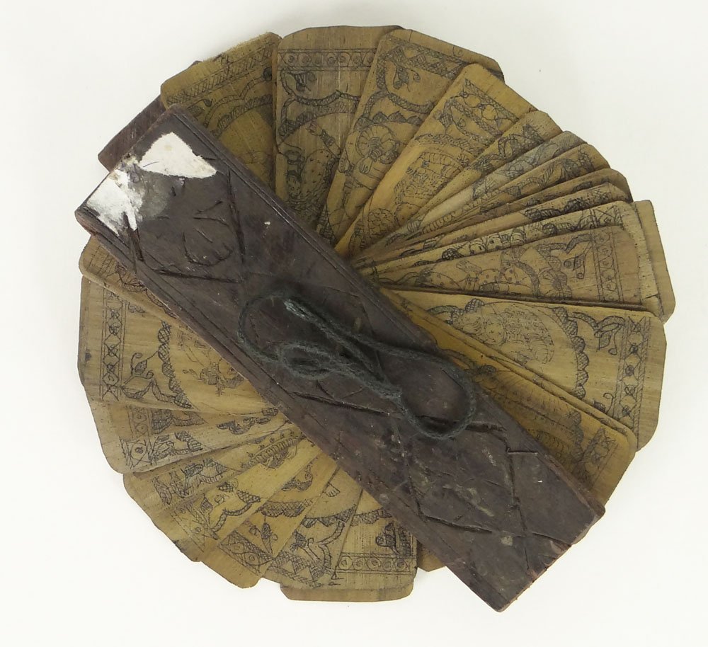 Rare 19th C Indian Erotic Palm Leaf Manuscript with: Rare 19th C Indian Erotic Palm Leaf Manuscript with Illuminations. This "book" Contains 19 Double Sided Palm Leaves depicting The Kama Sutra. Wood Covers. Measures approx 5-3/4 Inches by 1-1/2 Inches.
