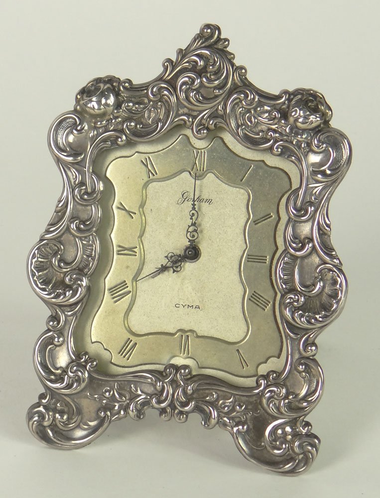 Antique Cyma Watch Co. Clock In Gorham Sterling Silver: Antique Cyma Watch Co. Clock In Gorham Sterling Silver Frame. Signed Gorham, Cyma Watch Co. Swiss. Stand Included but Not Attached to Back Of Clock. Not in Running Order. Measures 5 Inches Tall, 3-1/2