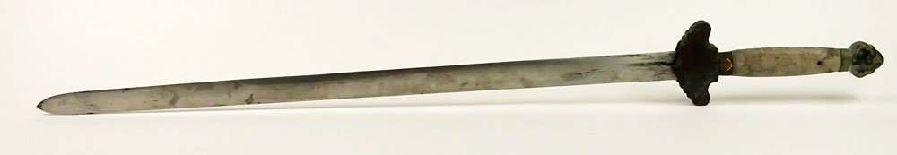 Antique Chinese Sword With Shagreen Grip and Scabbard: Antique Chinese Sword With Shagreen Grip and Scabbard With Brass Mounts. The Pommel and Guard in Bronze. Remnants of a Seal with Calligraphy On Handle. Antique Condition. Measures 41 Inches Length. Sh