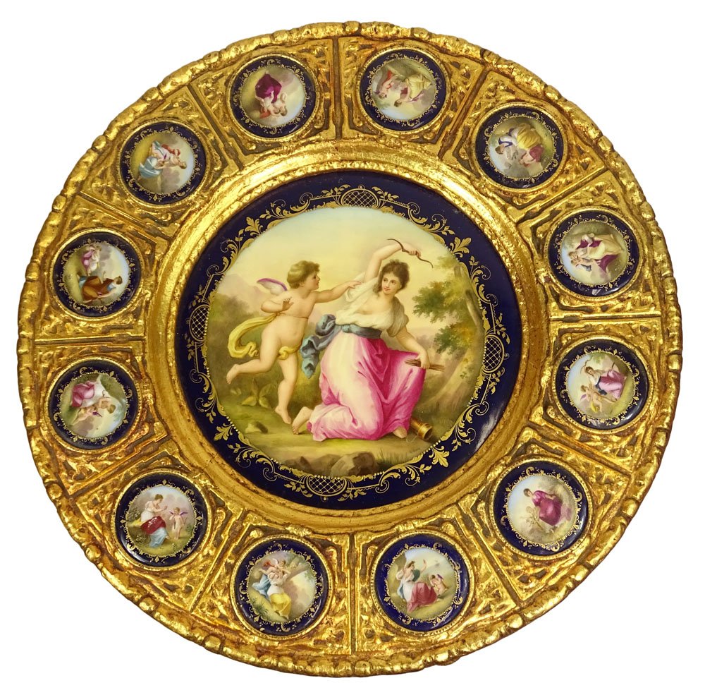 19/20th Century Louis XV style Sevres Porcelain Mounted: 19/20th Century Louis XV style Sevres Porcelain Mounted Carved and Giltwood Pedestal Table. The Top Mounted with Thirteen (13) Classical Style Plaques, the Central Plaque Depicting Cupid and Venus. Ta