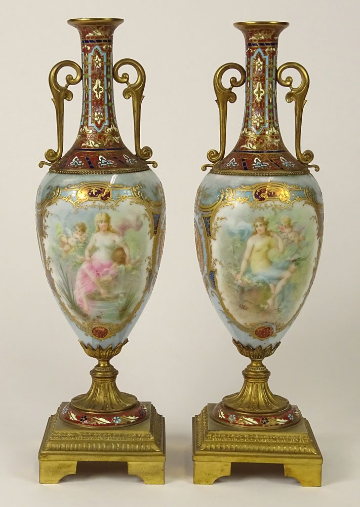 Very Fine Pair of 19/20th Century Probably French: Very Fine Pair of 19/20th Century Probably French Champleve Enamel Decorated Gilt Bronze Mounted Painted and Gilt Irredescent Luster Porcelain Urns. Porcelain likely Sevres or Royal Vienna. Reserve Pa