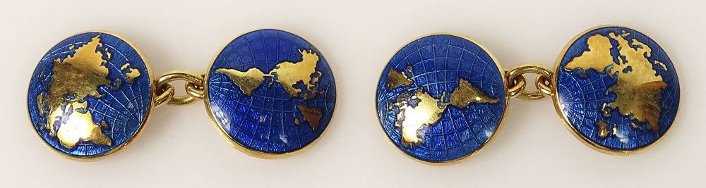18 Karat Yellow Gold and Enameled Cuff Links. World: 18 Karat Yellow Gold and Enameled Cuff Links. World Globe Map Motif. Signed England and Hallmarks 750, Birmingham, 1997. Makers Mark D & F. Good Condition. Weighs Approx. 8.30 Pennyweights. Shipping $