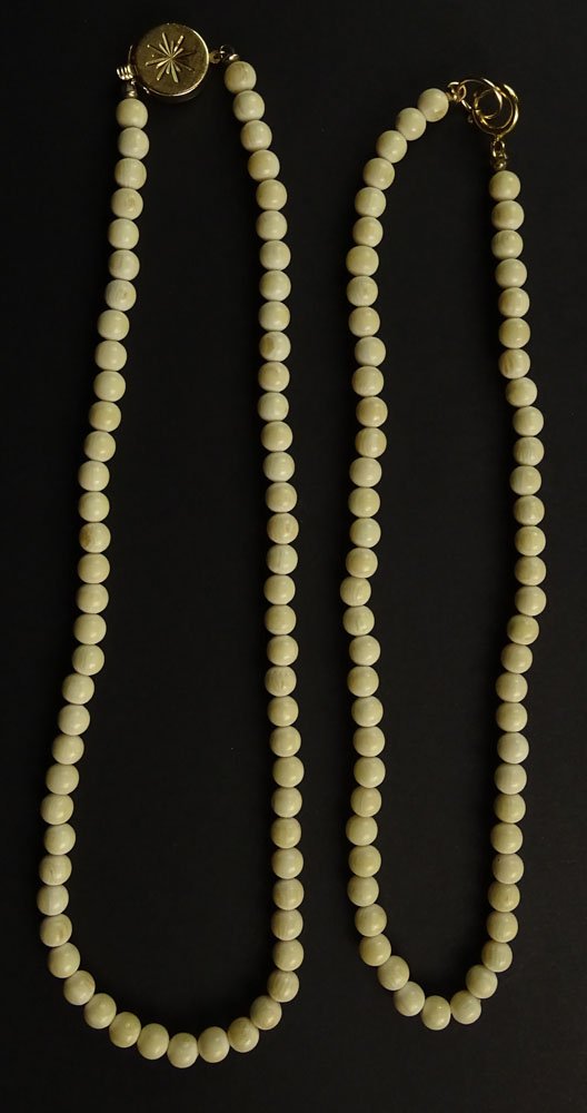 Two Ivory Bead Choker Necklaces with Gold Clasps. The: Two Ivory Bead Choker Necklaces with Gold Clasps. The Ivory Necklace with Springing Gold tone Clasp has Sixty Two (62) Ivory Beads Measuring 5-1/2mm to 6mm, and is Fourteen (14) Inches Long. The Ivory