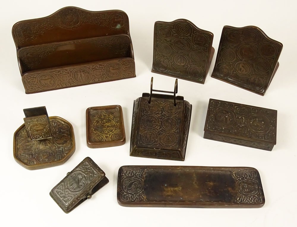 Tiffany Studios Gilt Bronze Zodiac Eight (8) Piece Desk: Tiffany Studios Gilt Bronze Zodiac Eight (8) Piece Desk Set. This Antique Set Includes: a Calendar Holder, 5-1/2 Inches Length, Letter Holder, 6-1/4 Inches Tall; Pen Tray, 10 Inches Length; Pair Booke