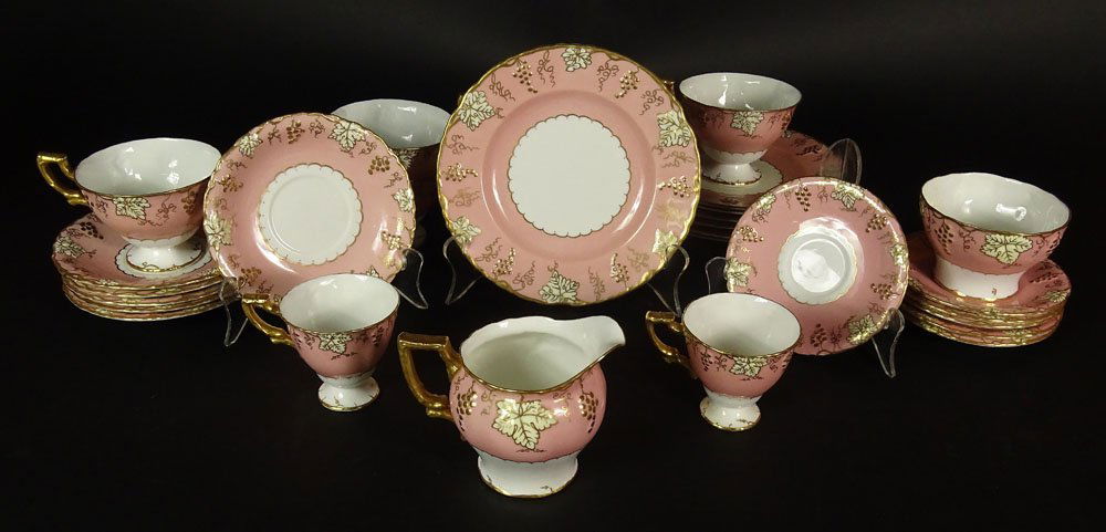 Twenty-Nine (29) Piece Royal Crown Derby Porcelain: Twenty-Nine (29) Piece Royal Crown Derby Porcelain Partial Dinnerware Set in the Vine Pattern. This Set includes: 7 Salad Plates, 7-1/4; 6 Cups & Saucers; 2 Demi-tasse Cups; 6 Saucers; Creamer; Open S