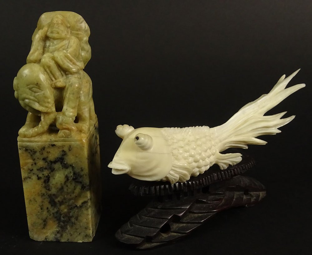 Vintage Chinese Carved Ivory Figurine of a Fish on: Vintage Chinese Carved Ivory Figurine of a Fish on Hardwood Stand, Signed, Small Losses Measures 5 Inches Length. Also a Chinese Figural Soapstone Ink Chop. Unsigned. Small Losses to Edge. Measures 4-