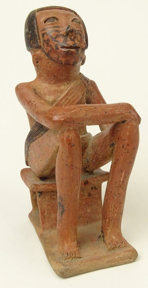 Small Pre-Colombian Terracotta Coquero or Coca Leaf: Small Pre-Colombian Terracotta Coquero or Coca Leaf Chewing Figure. Unsigned. Minor Edge Loss at Base. Measures 7 Inches Tall. Shipping $65.00