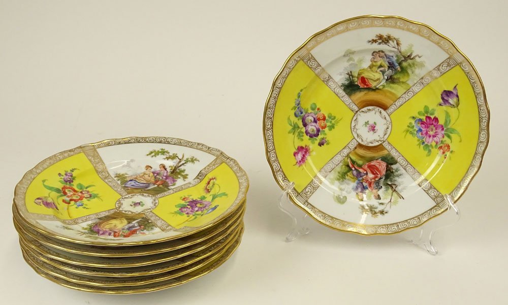 Lot of Seven (7) Antique Dresden Porcelain Plates. Each: Lot of Seven (7) Antique Dresden Porcelain Plates. Each with Floral and Romantic Transferred Decoration. Signed With Dresden Mark. Wear or in Good Condition. Measures 8 Inches Diameter. Shipping $75.0