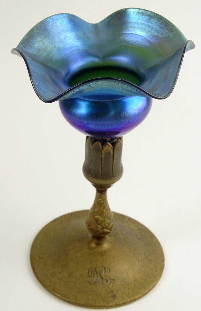 Antique Tiffany Blue Aurene Ruffled Vase atop a Gilt: Antique Tiffany Blue Aurene Ruffled Vase atop a Gilt Metal pinecone Base. Base Signed Tiffany Studios New York. The Glass With Losses to Bottom. Measures 8-3/4 Inches Tall. Shipping $65.00