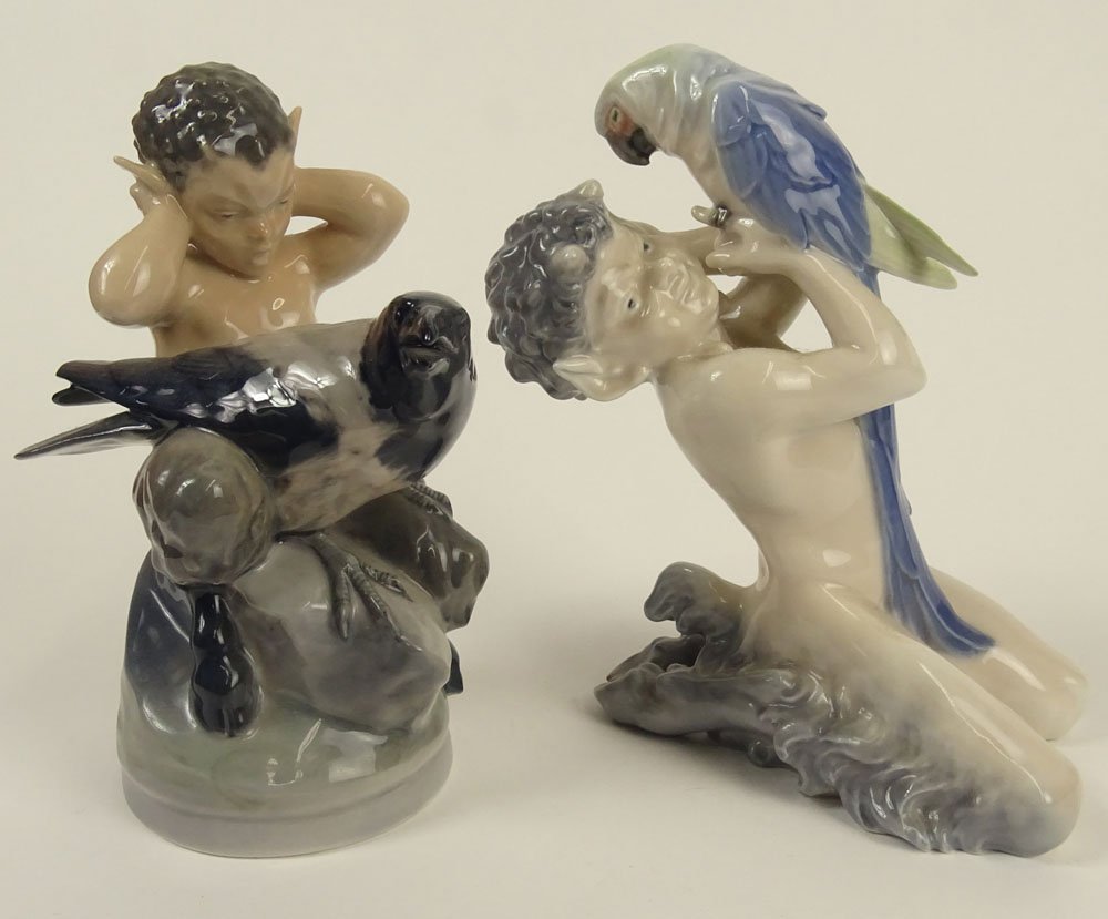 Lot of Two (2) Royal Copenhagen Porcelain Satyr: Lot of Two (2) Royal Copenhagen Porcelain Satyr Figurines. One With Parrot, On With Raven/Crow. Signed with Royal Copenhagen Backstamp and Wave Mark. The Mark on The Parrot Figure with one Slash. Good