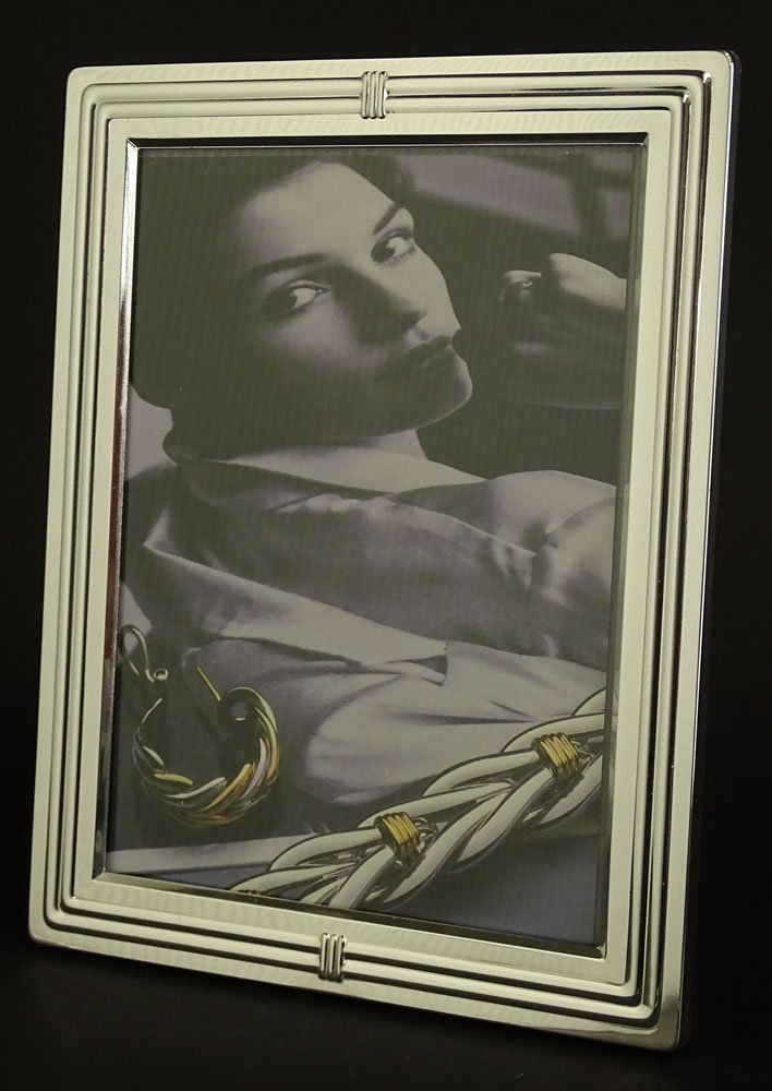 Christofle Silver Plate "Aria" Picture Frame. Signed: Christofle Silver Plate "Aria" Picture Frame. Signed Christofle France. Original Box. Very Good Condition. Measures 8-3/4 inches by 6-3/4 Inches. Hold a 7 Inches by 5 Inches Photo. Shipping $35.00