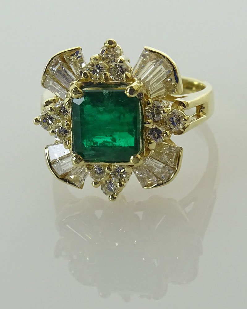 Lady's Step Cut Colombian Emerald, Diamond and 14 Karat: Lady's Step Cut Colombian Emerald, Diamond and 14 Karat Yellow Gold Ring. Emerald with Vivid Saturation of Color and Measuring approx. 7.5mm square. Diamonds G-H Color. VS Clarity. Signed 14K. Very Go