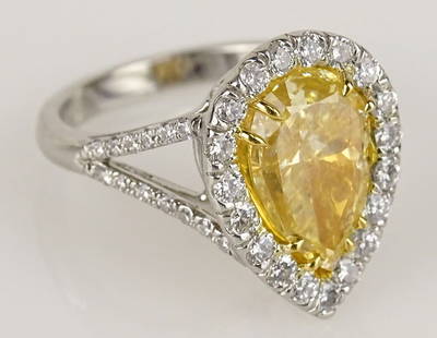 EGL Certified 4.0 Carat Pear Shape Fancy Yellow: EGL Certified 4.0 Carat Pear Shape Fancy Yellow Diamond, Platinum and 18 Karat Yellow Gold Engagement Ring accented with .89 Carat Round Cut Diamonds. Yellow Diamond SI1 Clarity. Accent Diamonds F-G