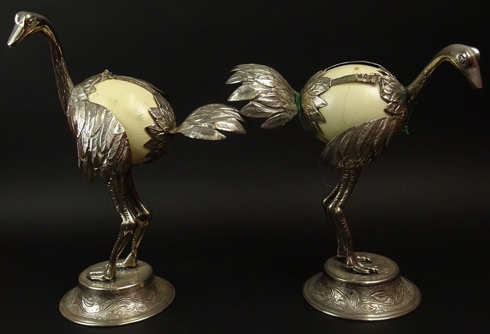 Pair of Antique Silver Plate and Ostrich Egg Ostrich: Pair of Antique Silver Plate and Ostrich Egg Ostrich Figurines. Unsigned. The Eggs are not set properly in the frame. They have been wired together, Minor Losses to Silver Plate, Wear. These are being