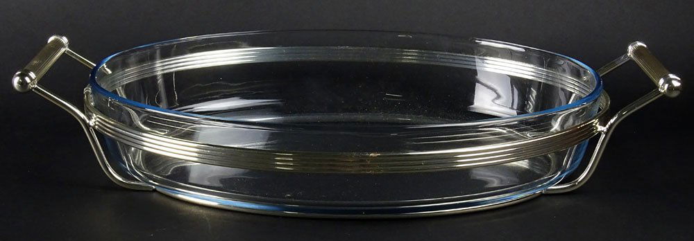 Christofle Silver Plate & Pyrex "Cortina" Oval Bake and: Christofle Silver Plate & Pyrex "Cortina" Oval Bake and Serve Set. Signed Christofle. Good Condition. Measures 14 Length. Green Velvet Anti-Tarnish Bag Included. Shipping $65.00