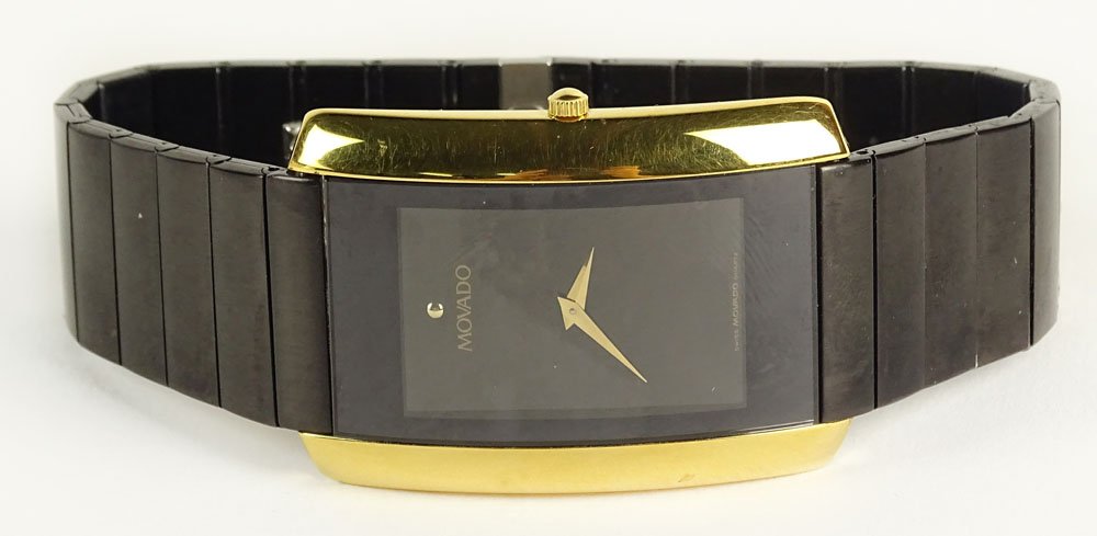 Man's Vintage Movado Blackened Stainless Steel and Gold: Man's Vintage Movado Blackened Stainless Steel and Gold Tone Quartz Movement Watch. Signed. Minor Surface Wear from Normal Use. Watch Appears to be Running. The Gallery does not Warranty the Running C