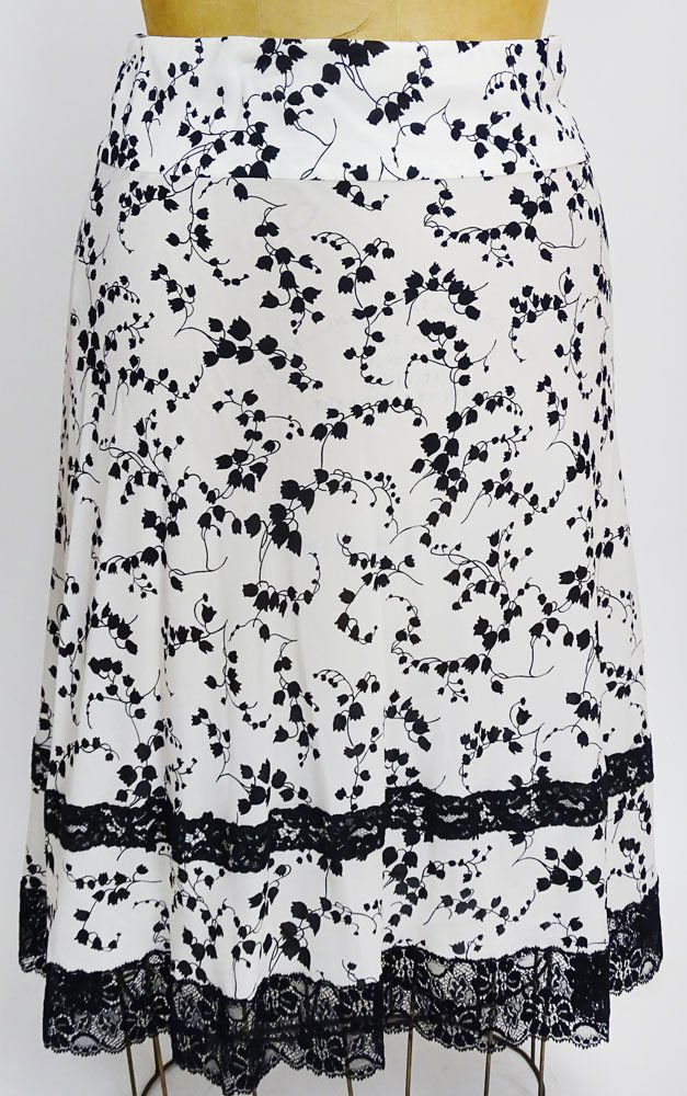 From a Palm Beach Socialite, A Dolce & Gabbana Print: From a Palm Beach Socialite, A Dolce & Gabbana Print Silk Skirt. Black Lace Trim. Labeled: Dolce & Gabbana Made In Italy. Size 42 (10 US) Good Condition. Length 26-1/2 Inches. Shipping $25.00