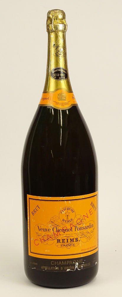 Vintage Veuve Clicquot Brut Yellow Label (6 Liter): Vintage Veuve Clicquot Brut Yellow Label (6 Liter) Champagne Bottle, Unopened. Bicentenair 1772-1972. Wear to Label and Foil. Measures 24 Inches Tall. We will not ship this item due to its size. We wi