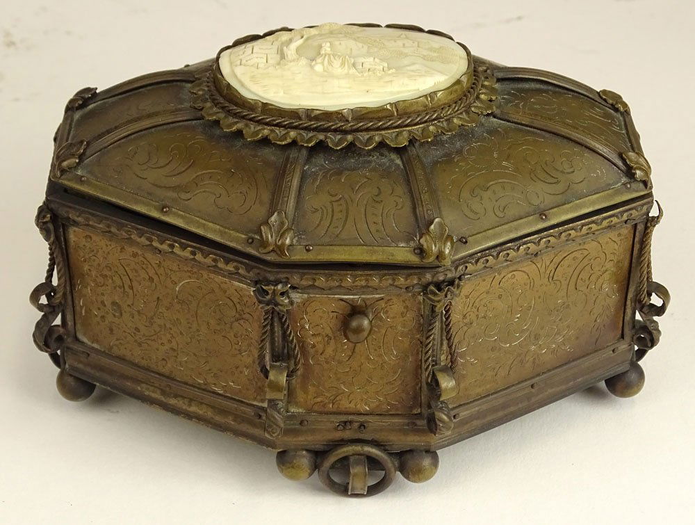 19th century Patinated white metal vanity box with: 19th century Patinated white metal vanity box with inset on top. Lined. Old repair to back ball feet, wear or in good condition. Measures 4 inches tall, 6 inches length, 4 inches width. This item will