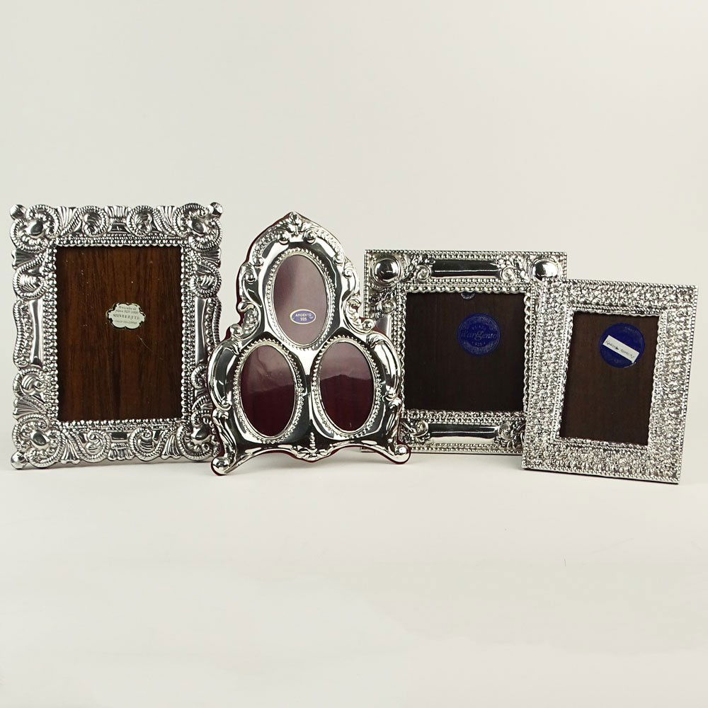 Lot of Four (4) Sterling Silver Picture Frames. All: Lot of Four (4) Sterling Silver Picture Frames. All with various 925 labels. Good condition. Measures 4-1/2" x 6-1/2", 4-1/2" x 4-1/2", 4-3/4" x 3-1/4" and a triple oval 3-1/2" x 2" each oval. Shippin