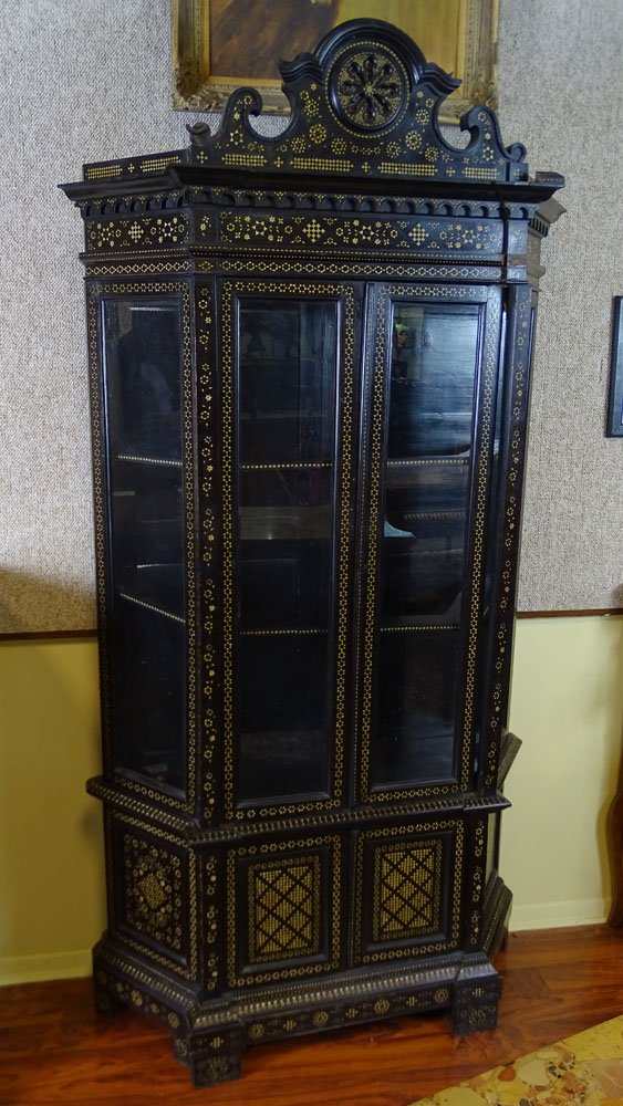 Vintage Moroccan Ebonized Wood and Inlaid Bone Display: Vintage Moroccan Ebonized Wood and Inlaid Bone Display Cabinet/Vitrine. Unsigned. Losses to moulding on bonnet, cracked glass on one panel, splits on other side panel, no shelves. Measures 83-1/2" H. 