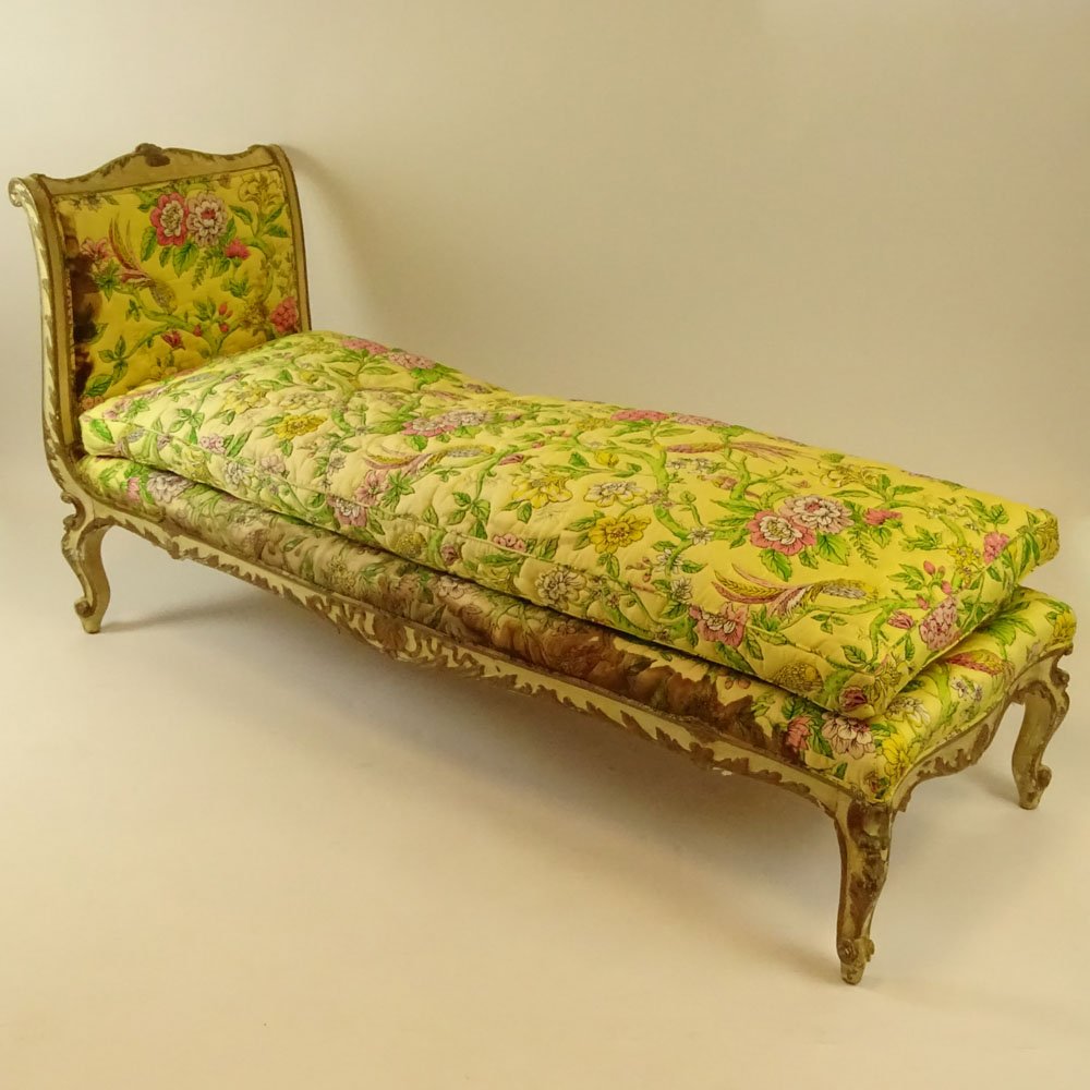 19th Century Italian carved, painted and parcel gilt: 19th Century Italian carved, painted and parcel gilt chaise lounge. Unsigned. Rubbing, surface wear, upholstery as is. Measures 37-3/4" H x 78" L. Shipping: Third party.