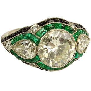 Very Fine Art Deco Design Approx. 4.25 Carat Cut: Very Fine Art Deco Design Approx. 4.25 Carat Cut Diamond, 1.50 Carat Colombian Emerald and Platinum Engagement Ring. Set in center with a 3.15 carat round cut diamond K color, SI1 clarity and flanked