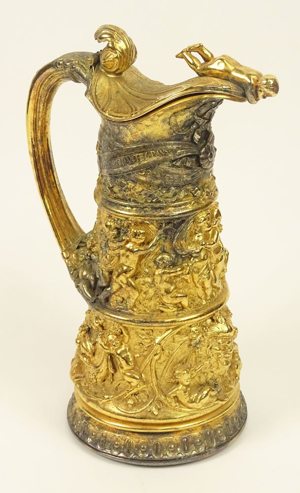 19/20th Century French Heavy Gilt Metal Ewer with: 19/20th Century French Heavy Gilt Metal Ewer with Relief Cherub and Mask Decoration. Unsigned. Rubbing and Losses to Gilt Surface Otherwise Good Condition. Measures 11 Inches Tall and 7-1/2 Inches Wid