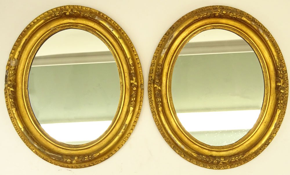 Pair of Gilt Carved Oval Mirrors. Unsigned. Losses, (1 of 3)