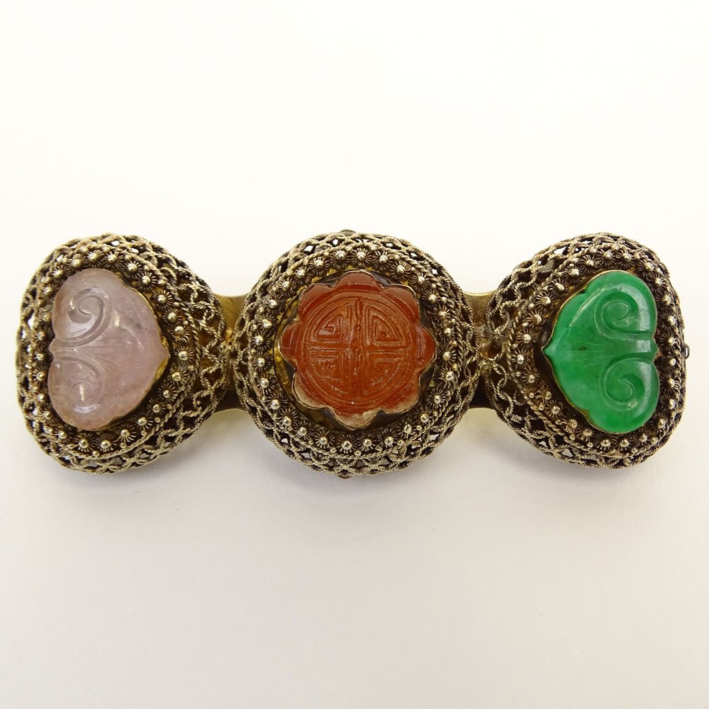 Antique Chinese Filigree Silver Brooch Set with Carved: Antique Chinese Filigree Silver Brooch Set with Carved Carnelian, Carved Jade and Carved Rose Quartz. Signed. Measures 1" H, 3" W. Shipping $30.00