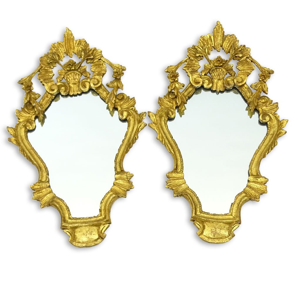 Pair Mid 20th Century Italian Decorative Giltwood: Pair Mid 20th Century Italian Decorative Giltwood Mirrors. Made In Italy labels en verso. Minor wear or in good condition. Measures 27" H x 15-1/2". Provenance: Collection of Robert Eigelberger, Casa 