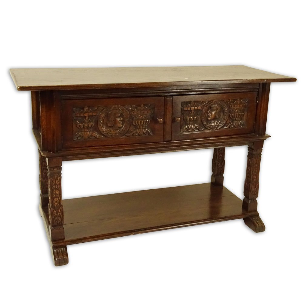 19/20th Century Italian Carved Oak Credenza. Unsigned.: 19/20th Century Italian Carved Oak Credenza. Unsigned. Surface wear and scratches from use and age. Moisture ring on surface, overall good condition. Measures 33" H x 54' W x 21" D. Provenance: Collec