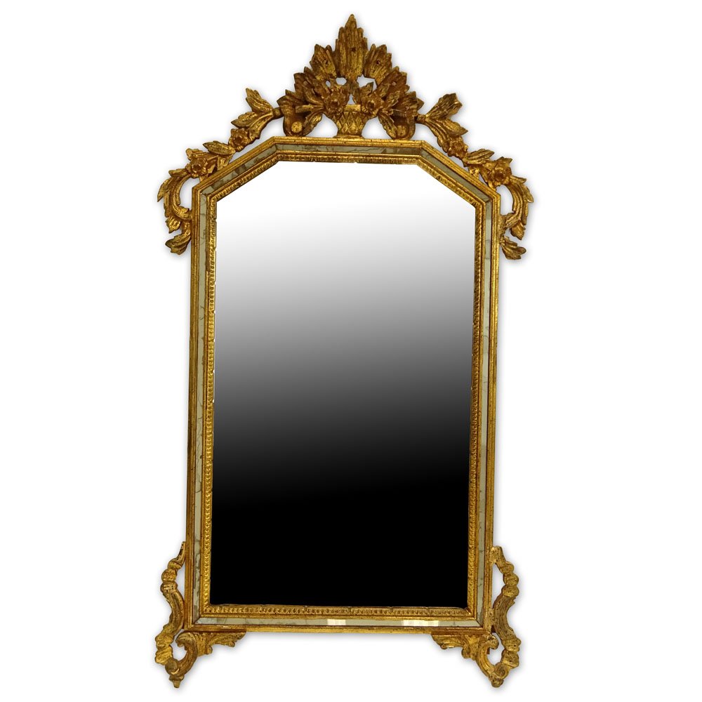 20th Century Italian Carved and Giltwood Mirror. Signed: 20th Century Italian Carved and Giltwood Mirror. Signed Made In Italy. Minor rubbing or in good condition. Measures 30" H x 22" W. Provenance: Collection of Robert Eigelberger, Casa Phippsberger, a pr