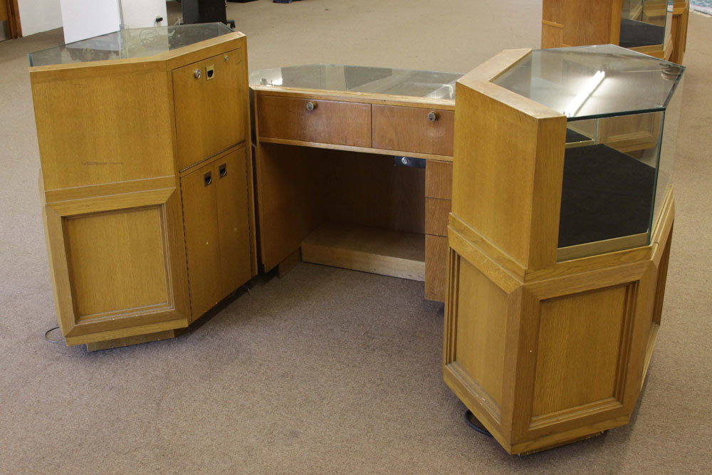 Vintage Three Part Oak and Glass Locking and Lighted: Vintage Three Part Oak and Glass Locking and Lighted Display Cabinet/Showcase with Storage. Used condition, surface wear. Center section measures 2' 8" H, 4' 10" W, 1' 10" D. Shipping: Third party (es