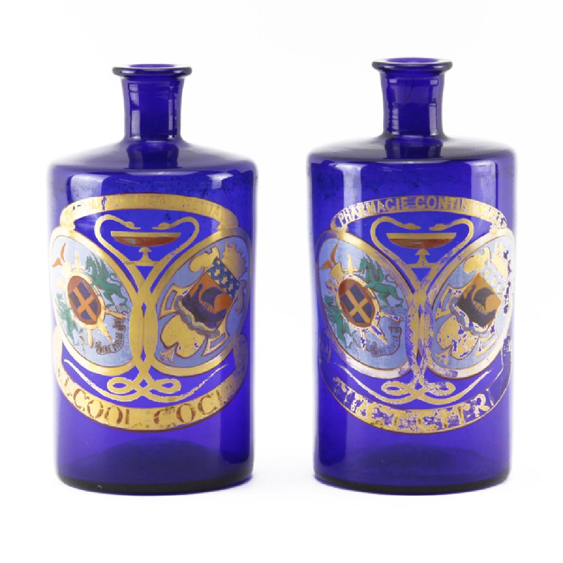 Pair of Cobalt Glass Gilt Painted "Pharmacie: Pair of Cobalt Glass Gilt Painted "Pharmacie Continentale" Apothecary Bottles. Open pontil base. Minor gilt wear otherwise good condition. Measures 8-3/4" H. Shipping $58.00 (estimate $200-$400)