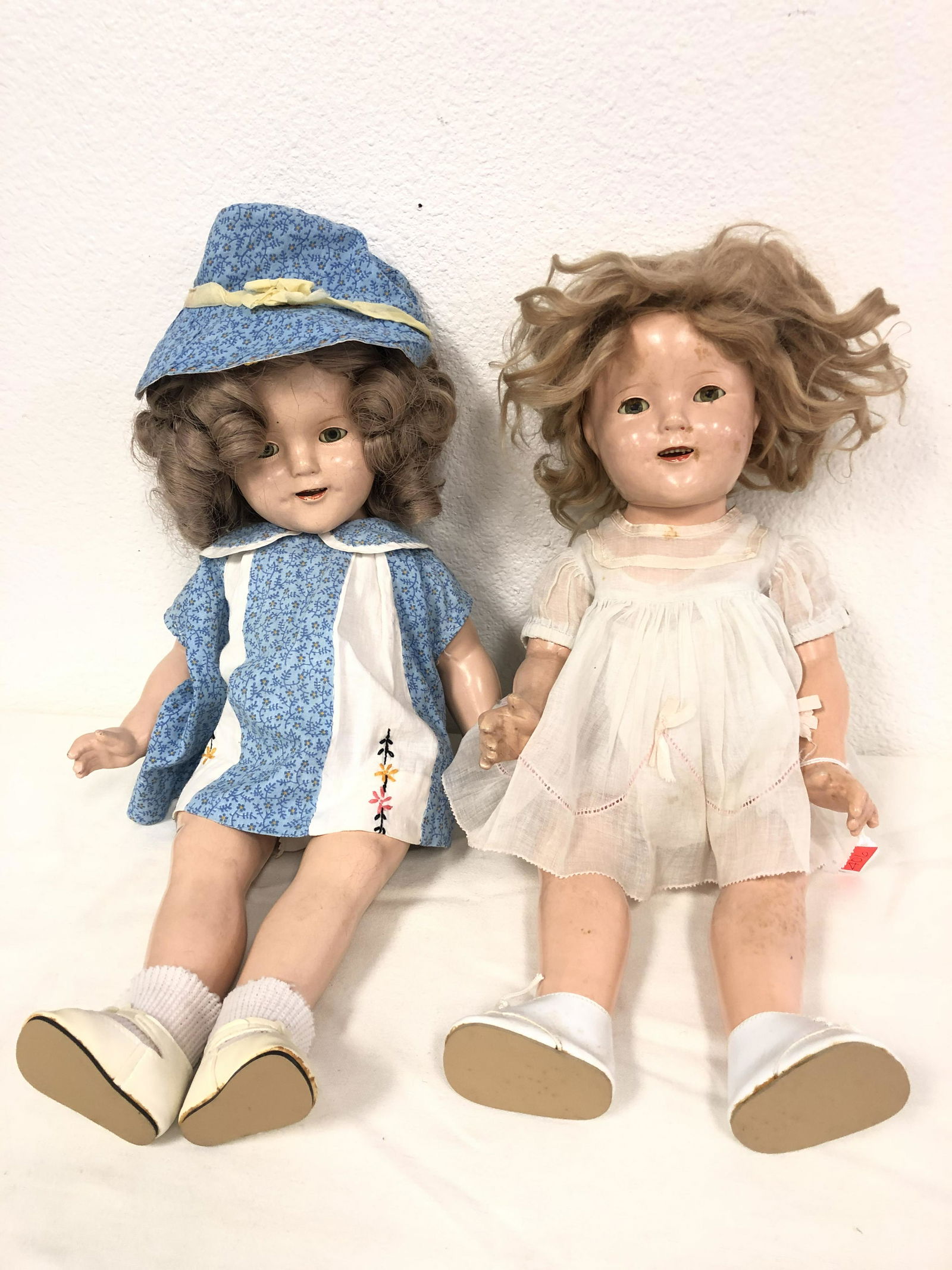 2 Vintage Composition Shirley Temple Dolls - 1 Unmarked: 2 Vintage Composition Shirley Temple Dolls - 1 Unmarked w/ Blue Dress, 1 Ideal Biege Colored