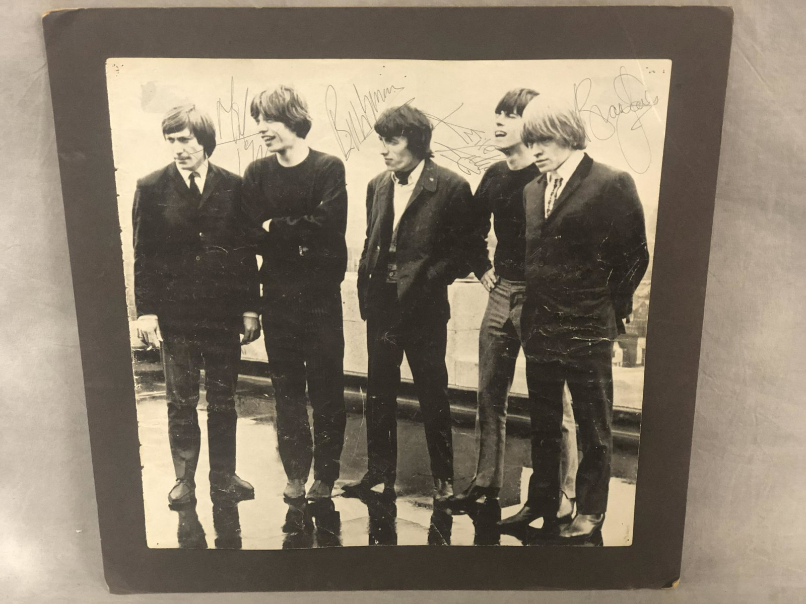 Signed Rolling Stones Paper, 10'' x 10'' - Brian Jones,: Signed Rolling Stones Paper, 10'' x 10'' - Brian Jones, Mick Jagger, Keith Richards, Bill Wyman - Has Pin Marks & Creases - No Certificate