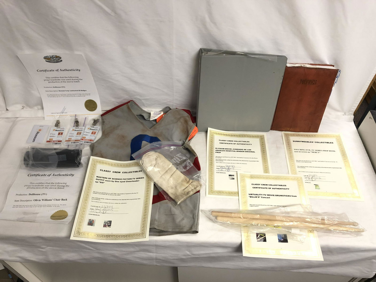 Asst Movie/ TV Props, Wardrobe w/ COAs - Dollhouse: Asst Movie/ TV Props, Wardrobe w/ COAs - Dollhouse Wardrobe & Badges w/ Certificates, Master of Science One Eye Cheerleader Wardrobe, Touching Evil