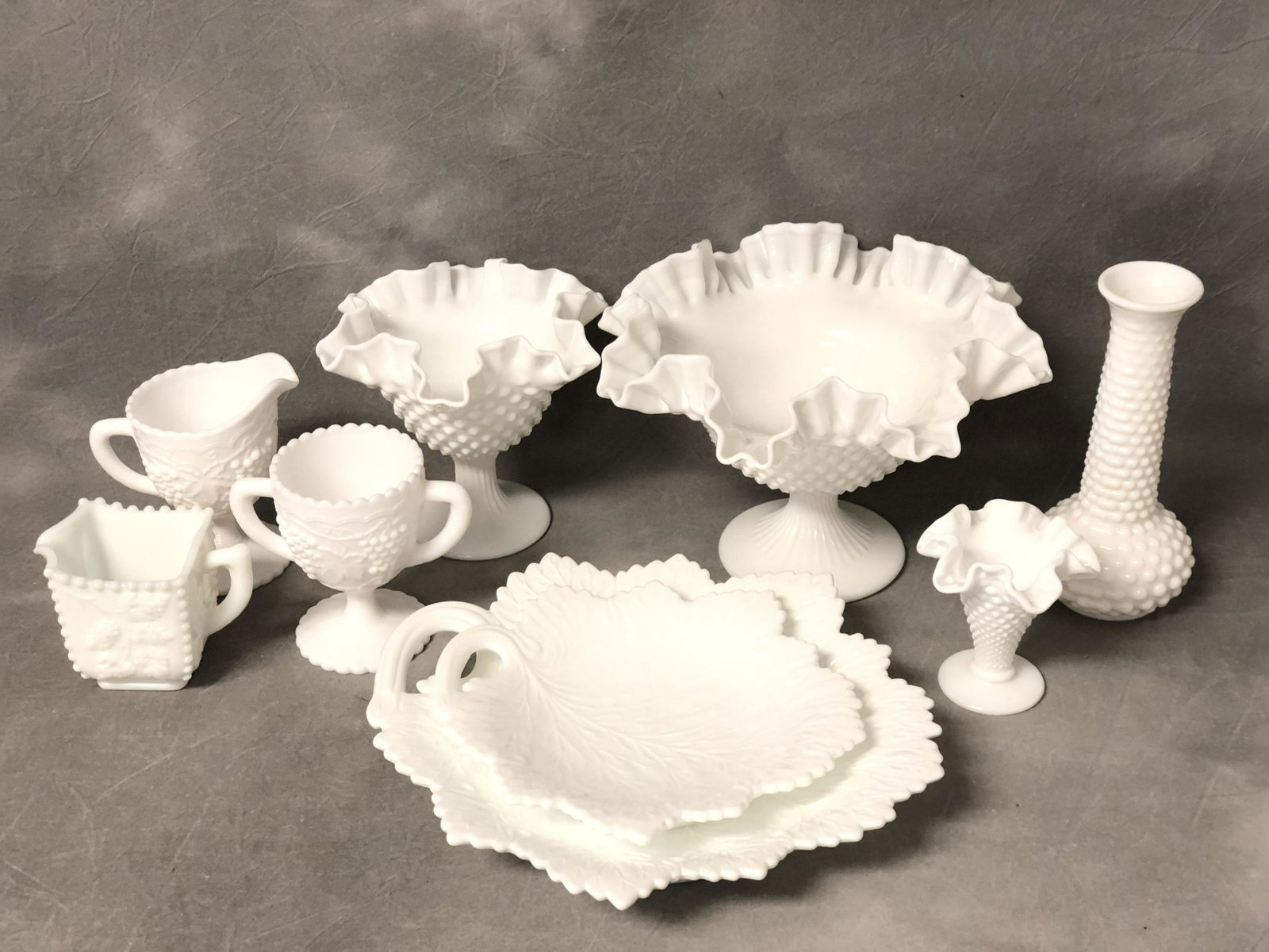 Lot of Asst Vintage Milk Glass Items - Hobnail Ruffled: Lot of Asst Vintage Milk Glass Items - Hobnail Ruffled Edge Bowls 9.75'' x 6.5'' & 6.75'' x 6'' , Grape Leaf Dishes, Creamers & Vase