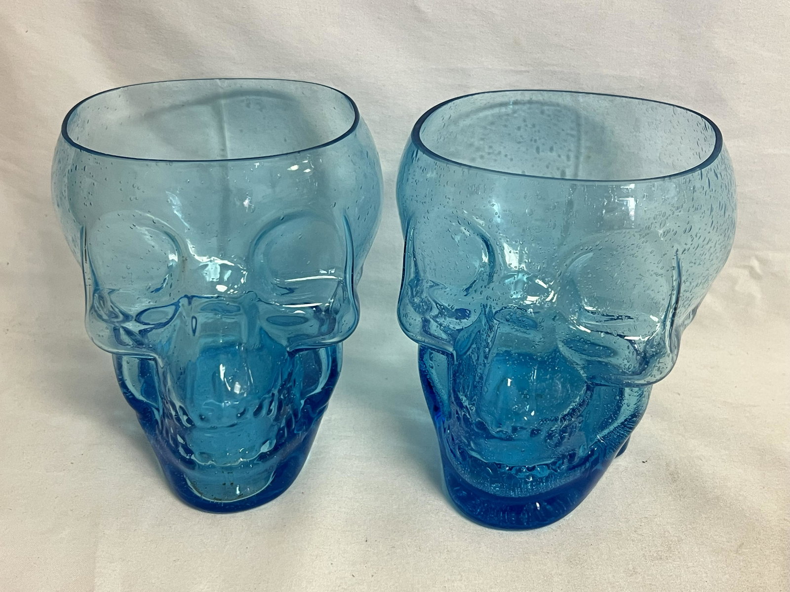 (2)Blue Art Glass Skull Vases, 6'' x 5.25'' x 6'': (2)Blue Art Glass Skull Vases, 6'' x 5.25'' x 6''