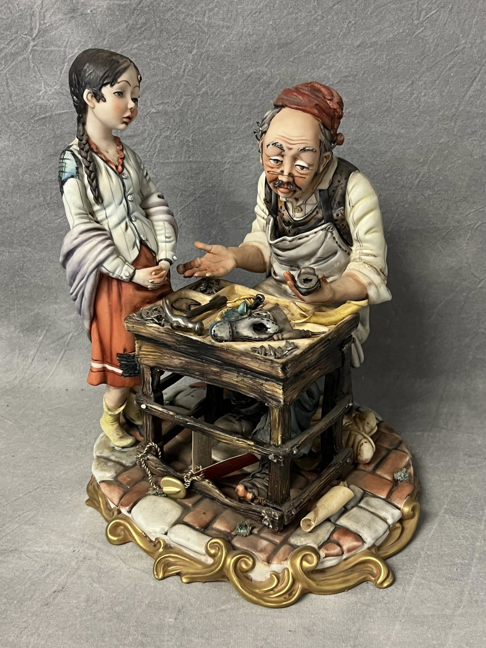 Capodimonte Signed Cobbler Figure w/ Tag - Hallmarked & Signed, 8.25'' x 10'': Capodimonte Signed Cobbler Figure w/ Tag - Hallmarked & Signed, 8.25'' x 10''