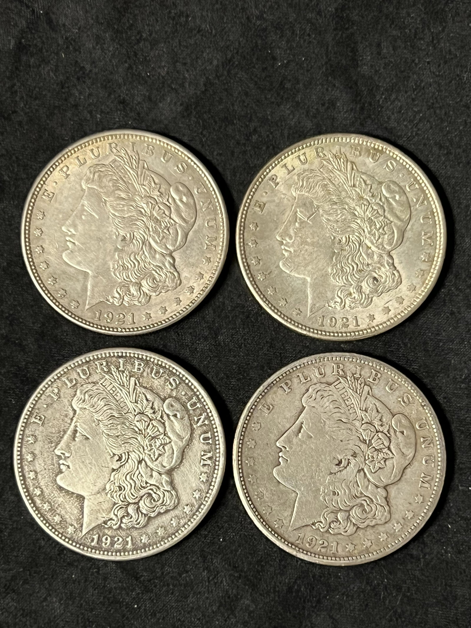 (4)1921 Morgan Silver Dollars - (1)San Francisco Mint, (3)Philadelphia Mint - Various Condition / (1 of 2)