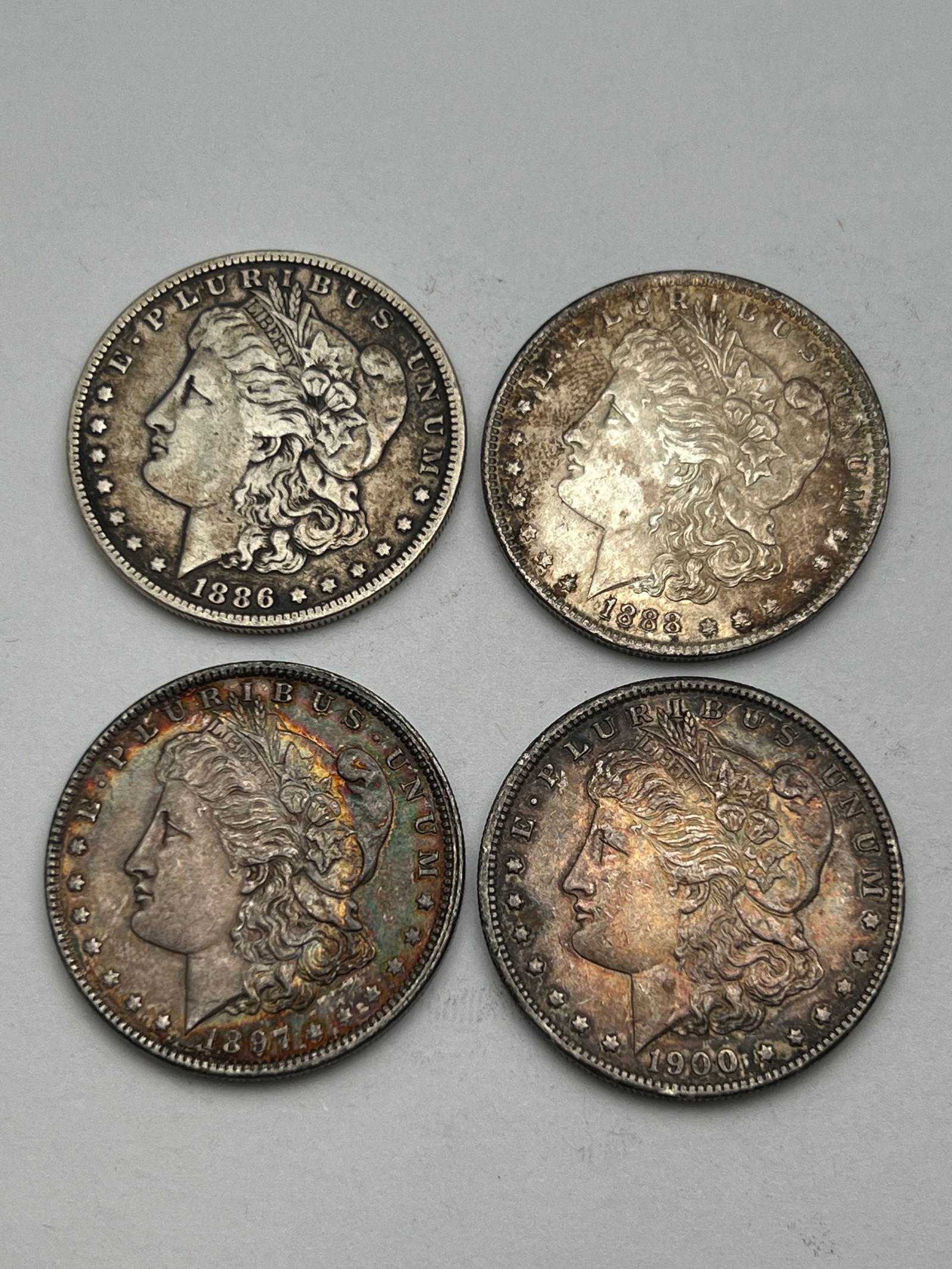 (4)1886-1900 Morgan Silver Dollars - (1)1886, (1)1888, (1)1897, (1)1900 (1 of 2)