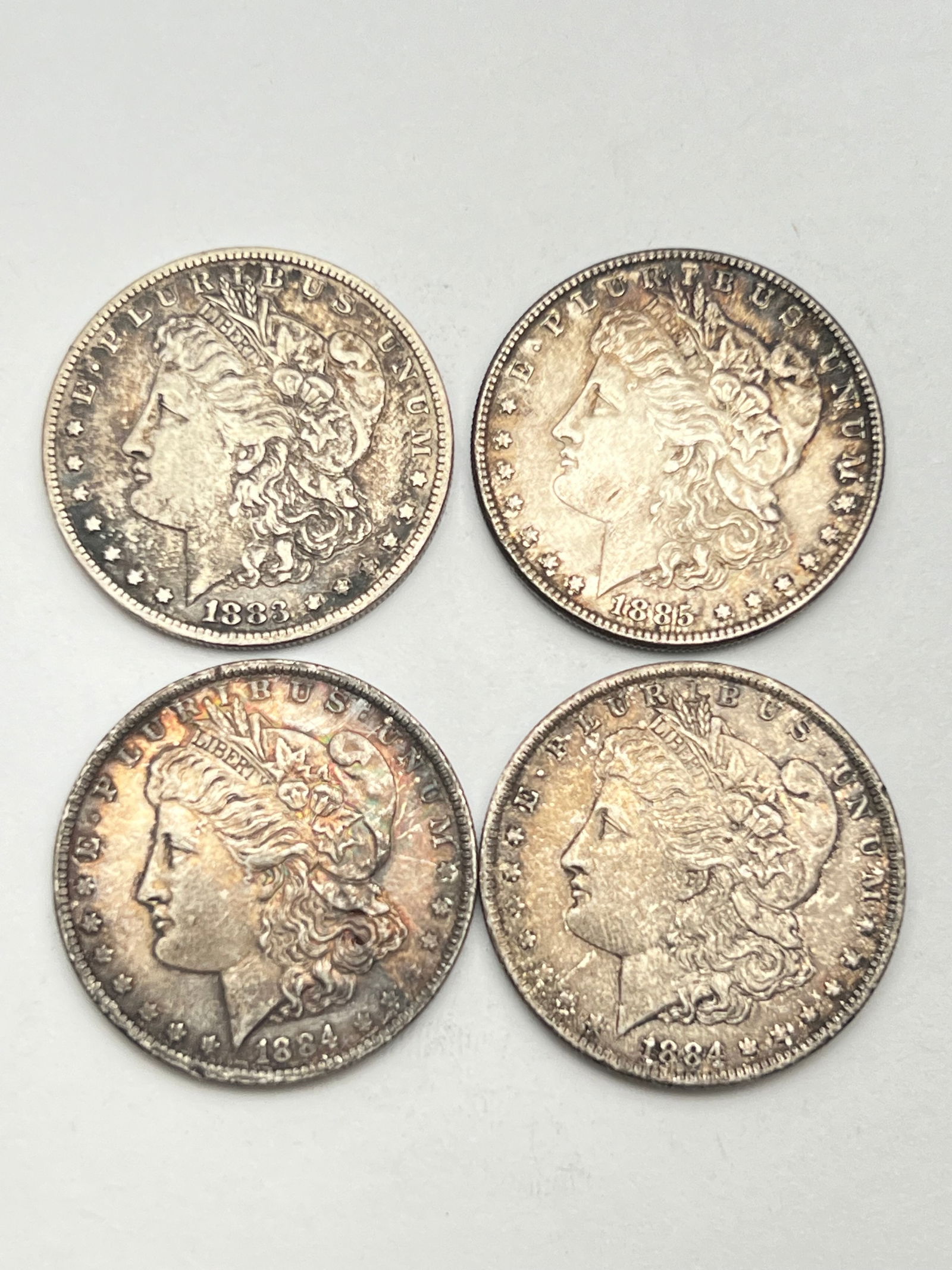 (4)1883-1885 Morgan 90% Silver Dollars - (1)1883, (2)1884 New Orleans, (1)1885 Philadelphia (1 of 2)