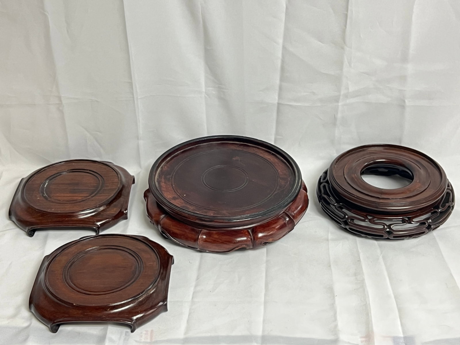 (4)Chinese Carved Wood Base Stands - (2)7'' , (1)8'' , (1)10'' Inspect 1 foot: (4)Chinese Carved Wood Base Stands - (2)7'' , (1)8'' , (1)10'' Inspect 1 foot