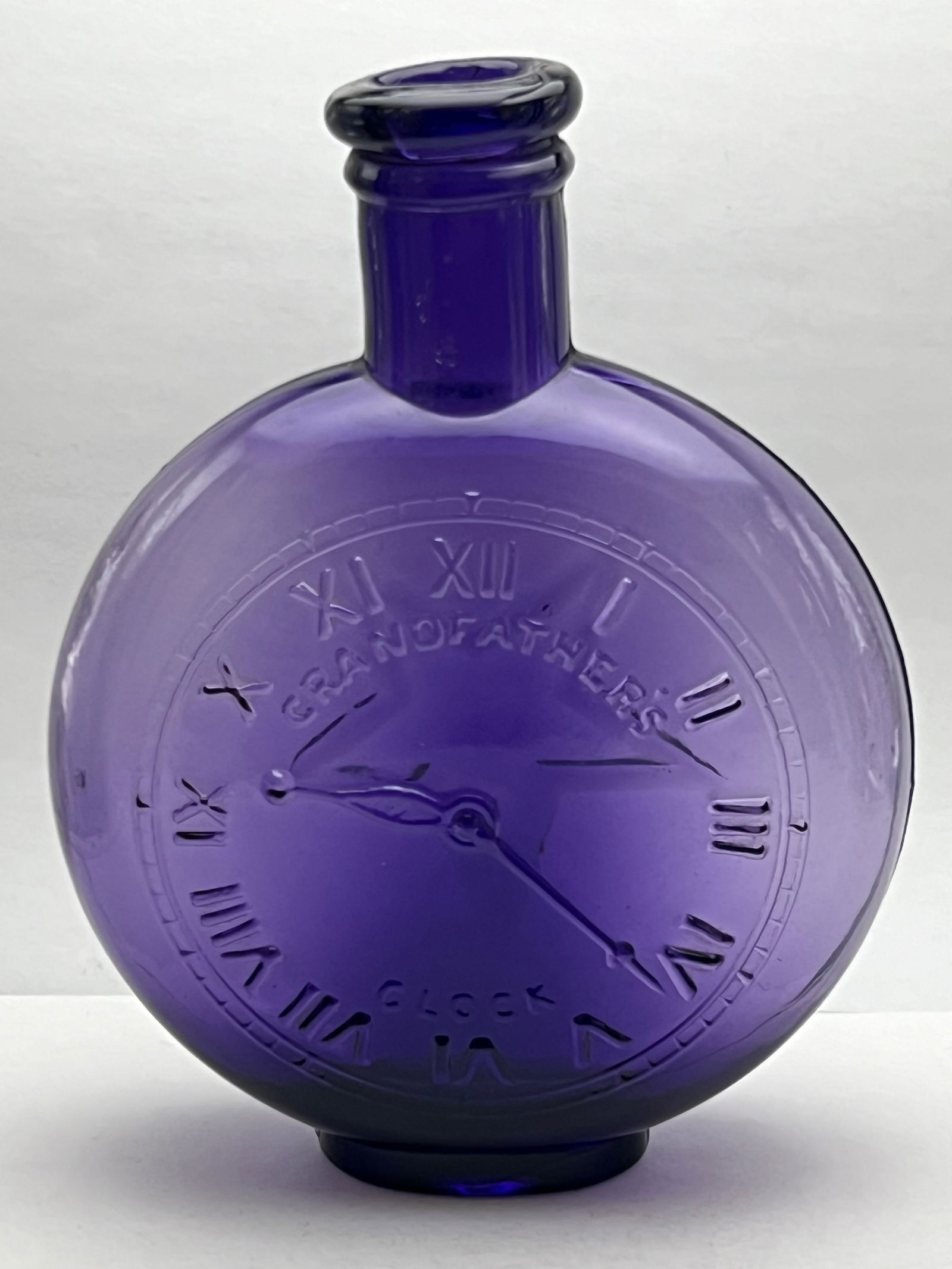 Atq Advertising Whiskey Flask Bottle - Purple w/ Star & Grandfather Clock 5.25''T: Atq Advertising Whiskey Flask Bottle - Purple w/ Star & Grandfather Clock 5.25''T