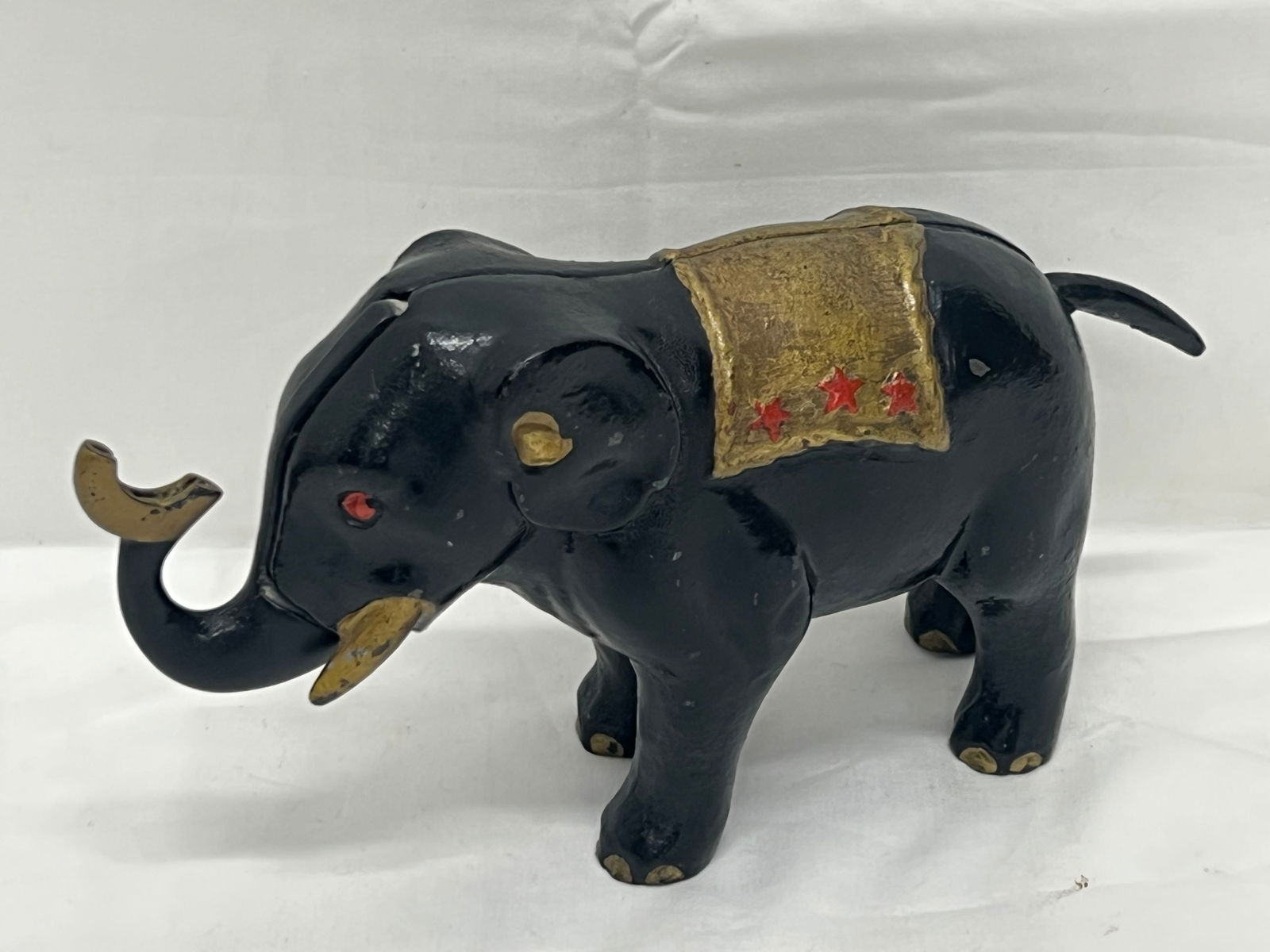 Atq Cast Iron Mechanical Elephant Bank - Painted Black & Gold w/ 3 Red Stars - Press Tail to Move (1 of 5)