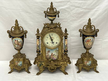 Italian Franz Hermle Lancini Garniture 3pc Set - 3pc Porcelain - Mantle Clock w/ Gilt Brass 9'' x: Italian Franz Hermle Lancini Garniture 3pc Set - 3pc Porcelain - Mantle Clock w/ Gilt Brass 9'' x 17'' + Pr Matching Urns Cobalt Blue w/ Pictorial 5'' x 4'' x 13''