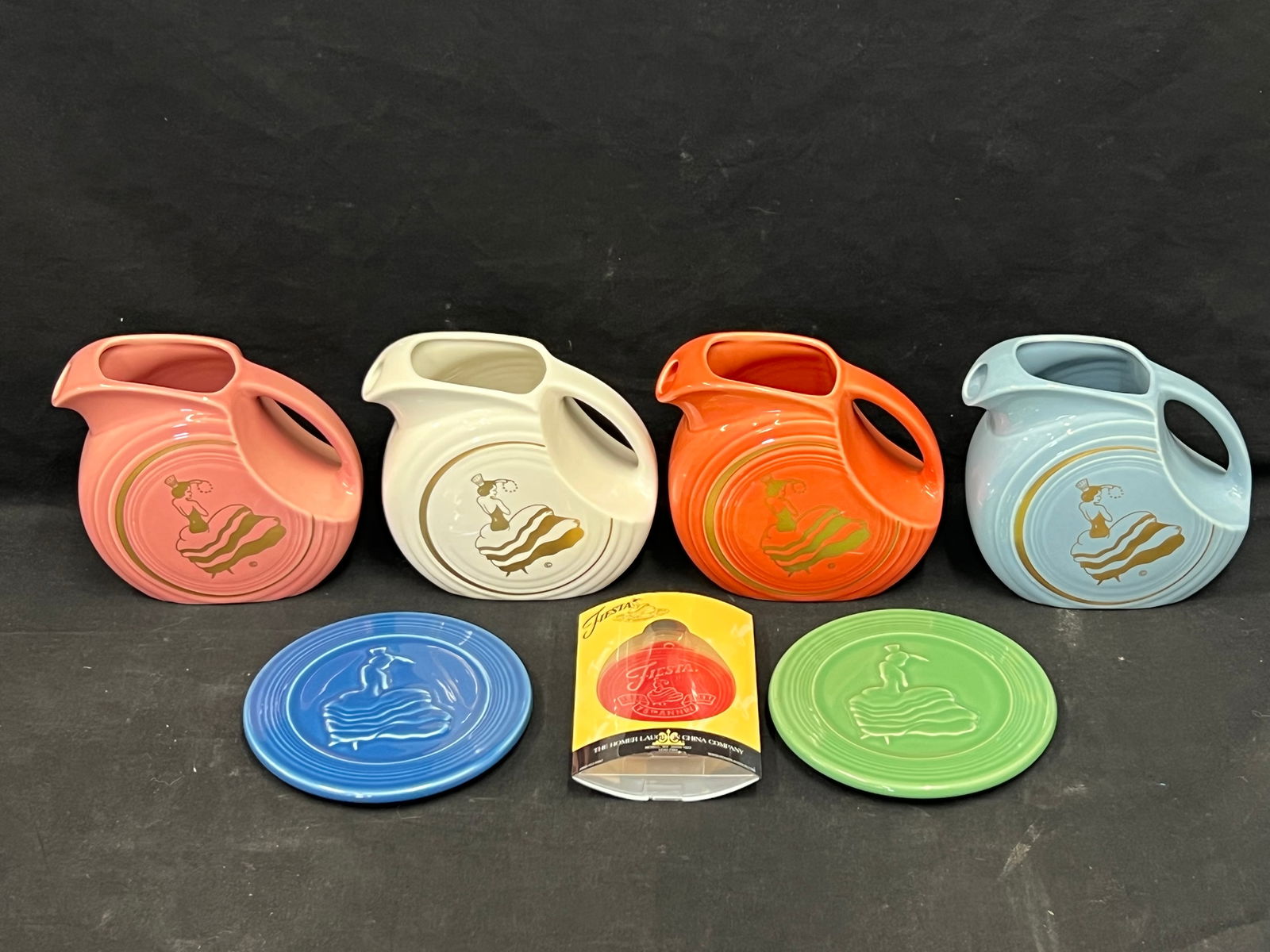 7pcs Asst Fiesta- Dancing Lady Disk Pitcher, Trivets - (4)Various Colored Dancing Lady Juice (1 of 10)